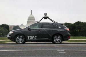 Torc vehicle driving past the United States Capitol Building.