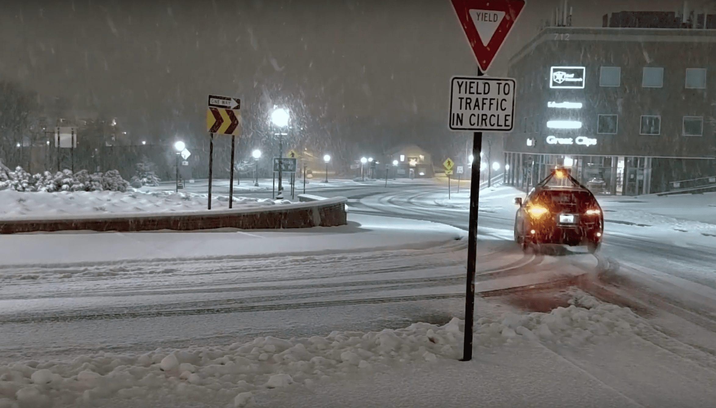 Asimov, Torc's self-driving vehicle, navigates a traffic circle in heavy snow.
