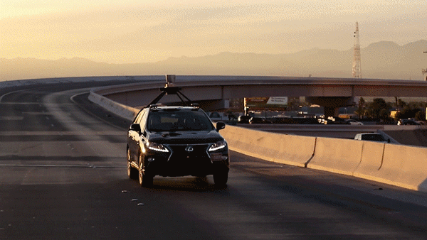 Asimov driving on a Vegas highway at sunset.