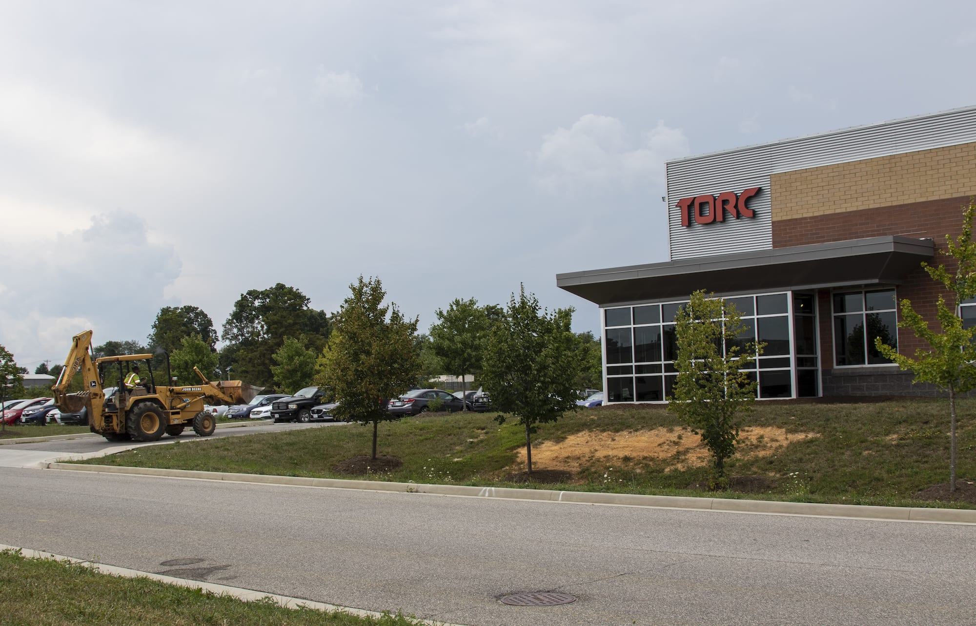 Construction equipment arrives at Torc headquarters.|