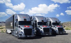 Group shot of three Torc Freightliner Cascadia trucks